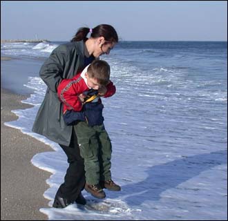 Rinor Peci and his mother Myzafere from Kosovo in former Yugoslavia. His first big water, the Atlantic Ocean, New Jersey, February 16 2002